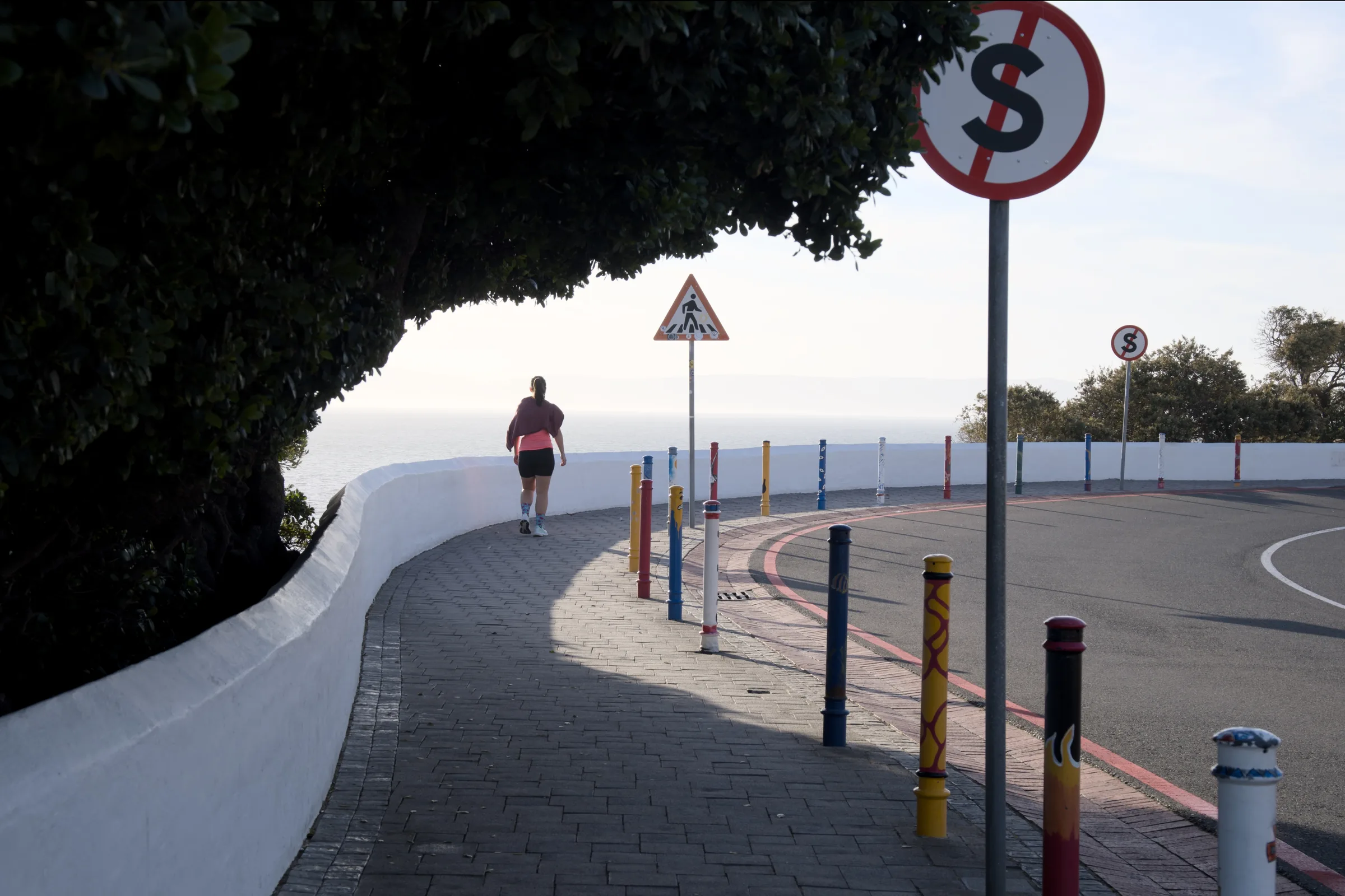 Colourful painted bollards in old town Hermanus